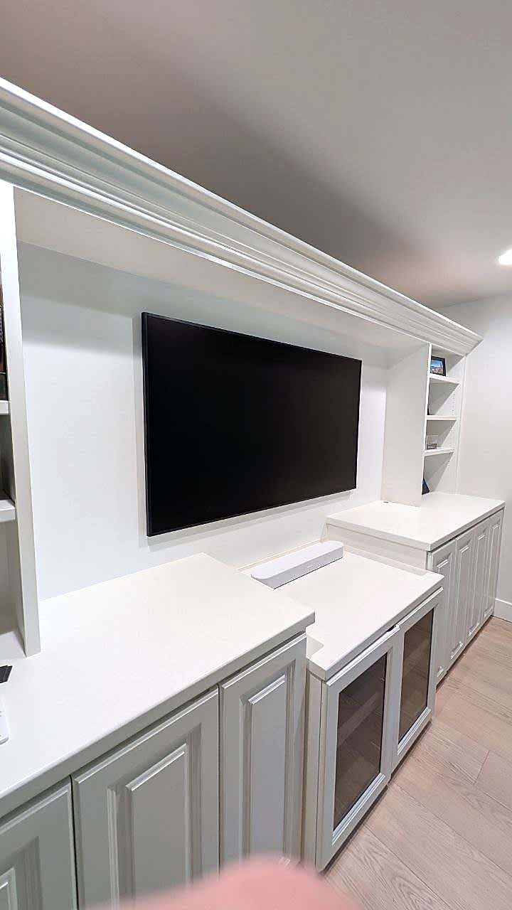 Samsung Frame TV mounted in custom built-in cabinets with Sonos soundbar and hidden wires in Arden, CA