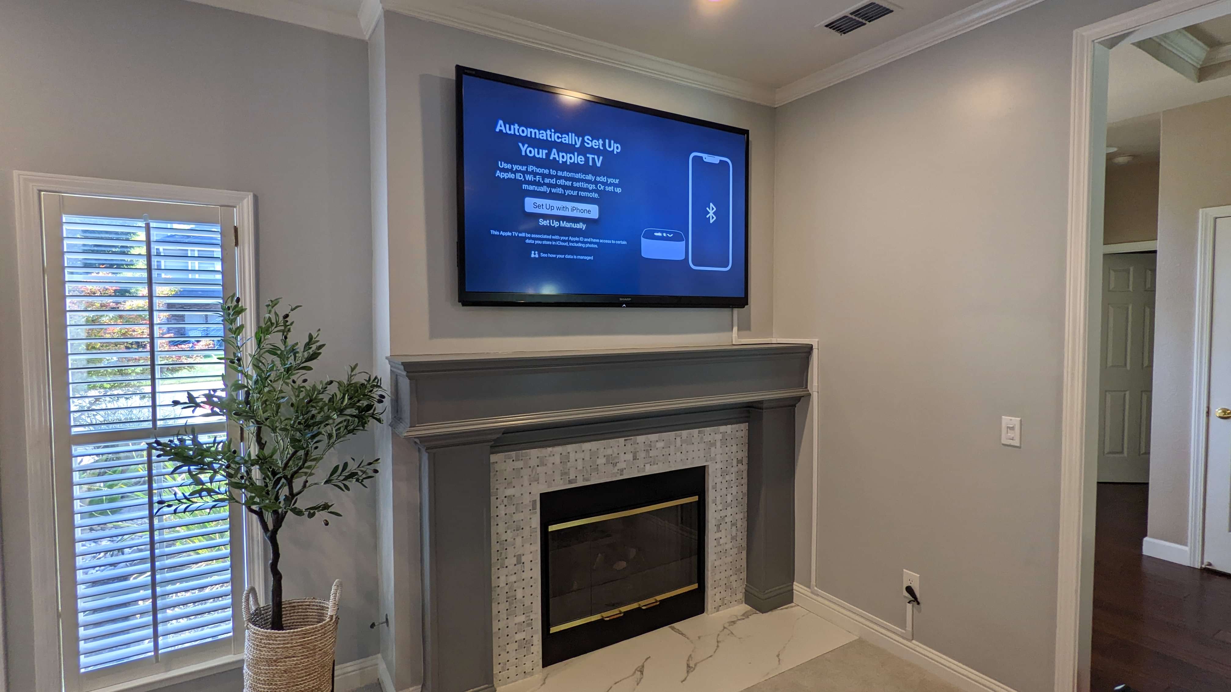 TV above marble tile fireplace in Orangevale, CA