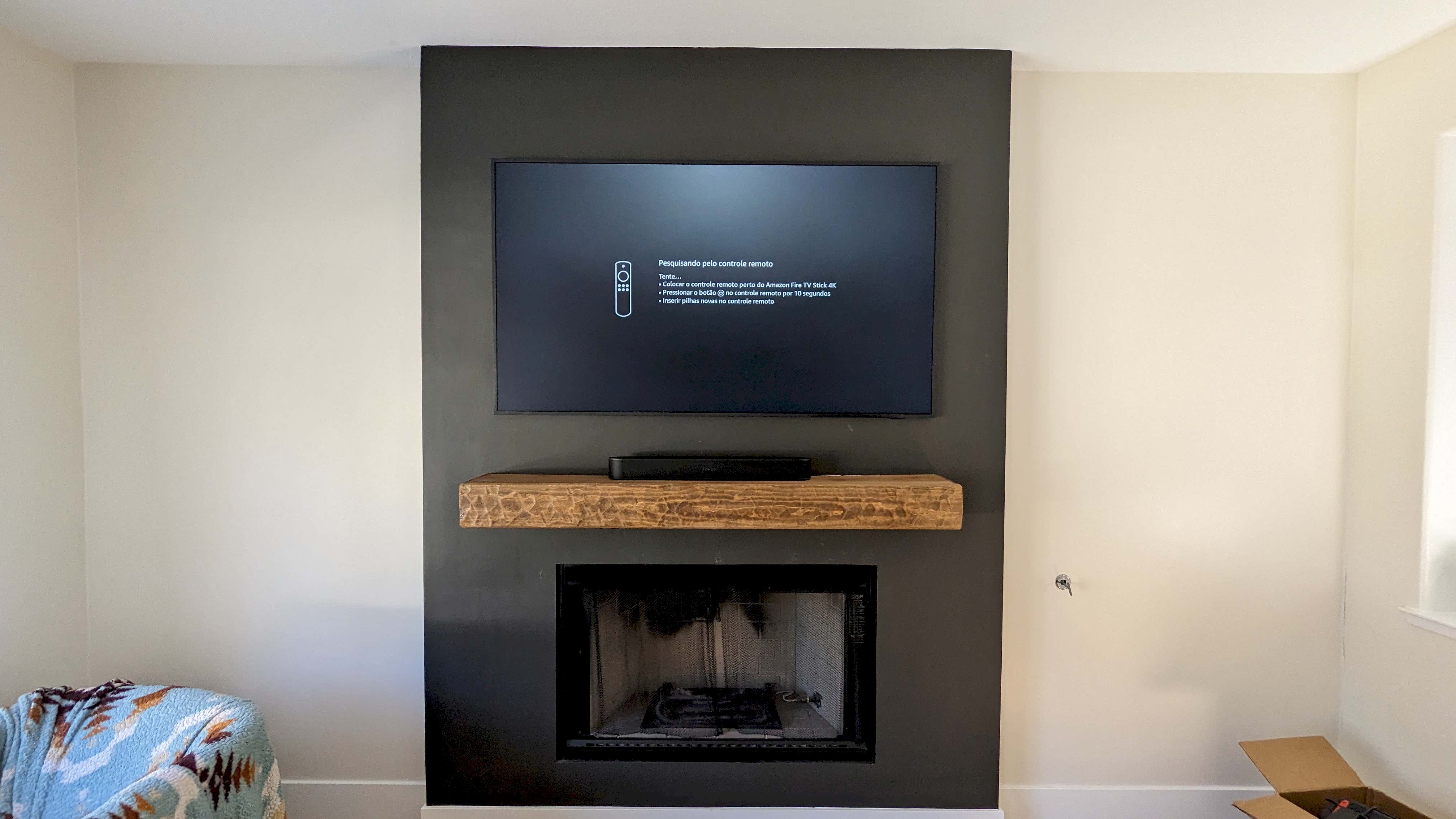 TV above fireplace with rustic wood mantel in Rocklin, CA